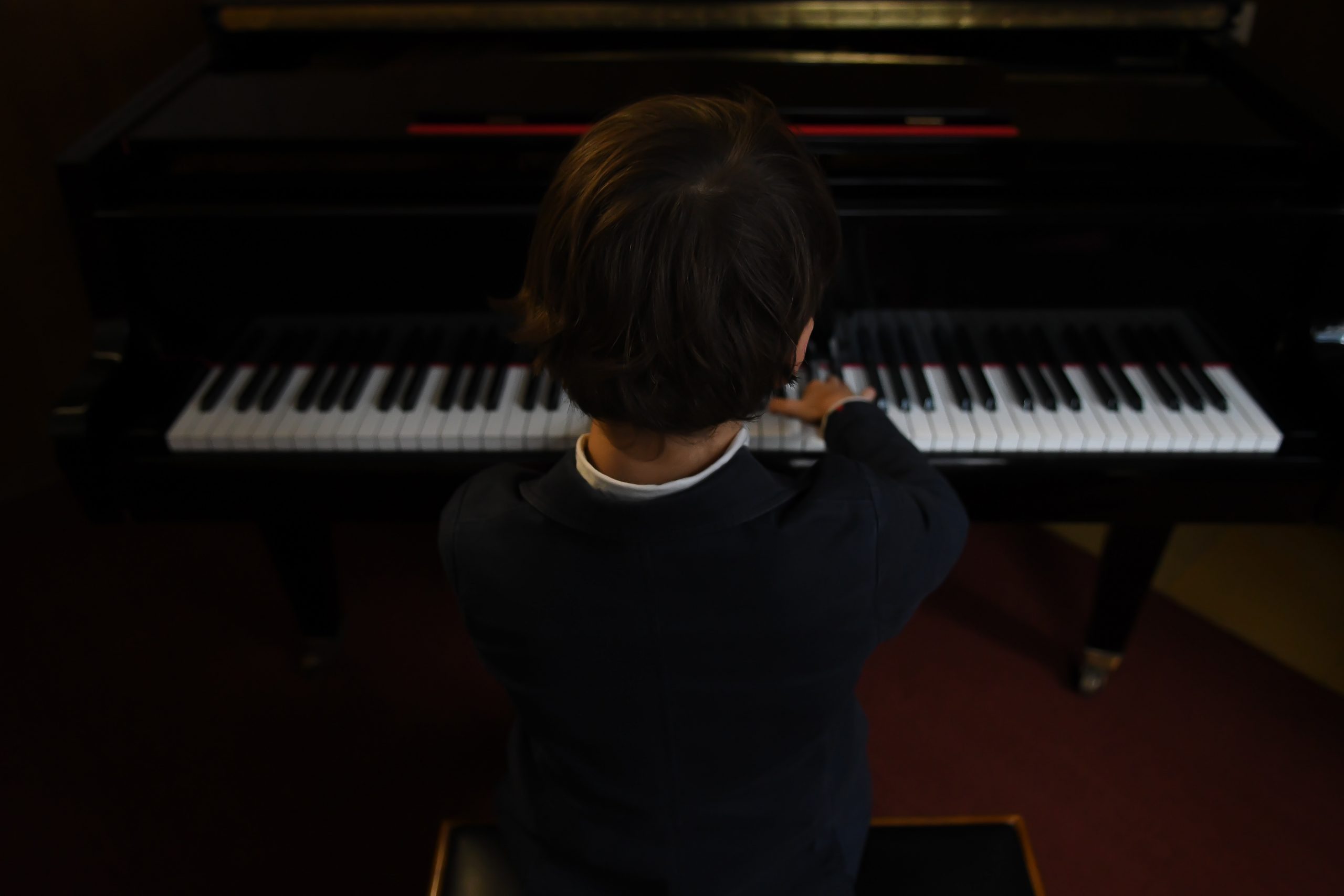 boy playing piano